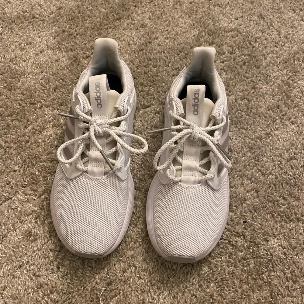 These all white Adidas sneakers are a size 7 in women’s